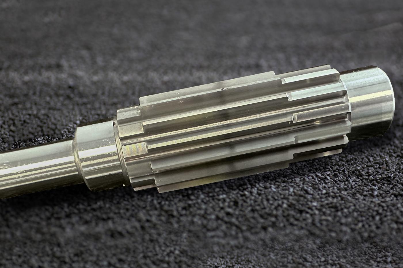 Contract manufacturing of grinded pinion shafts Pinion shaft grinded in contract manufacturing